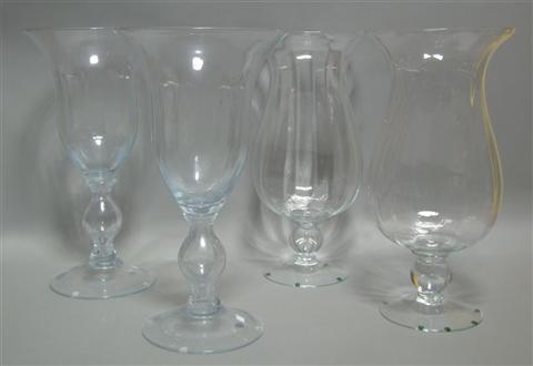 Appraisal: A PAIR OF ELEGANT GLASS HURRICANES of simple design with