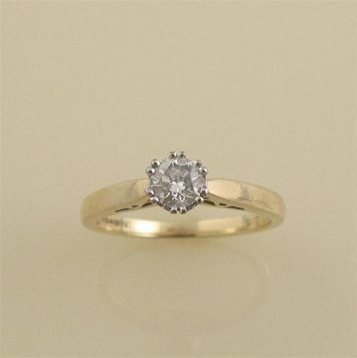 Appraisal: A diamond solitaire ring The brilliant cut diamond weighs approximately