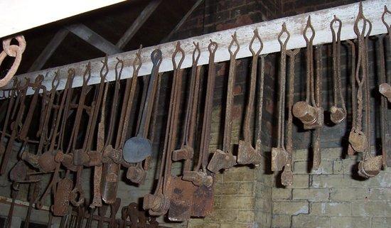 Appraisal: A quantity of blacksmith's tools including branding irons shovels etc