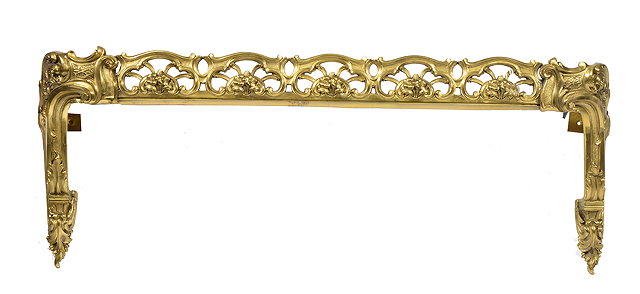 Appraisal: A POLISHED BRASS FRENCH RECOCO STYLE OVERDOOR CURTAIN PELMET pierced