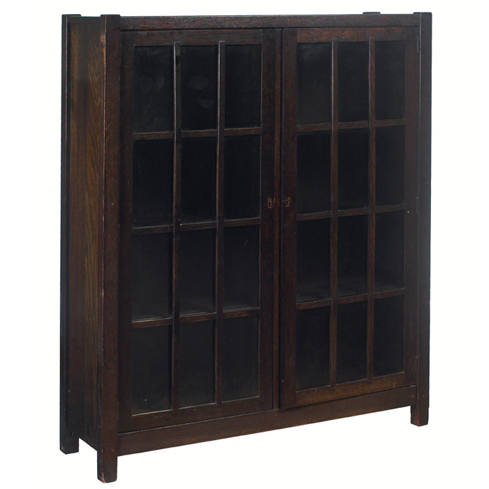 Appraisal: Arts Crafts bookcase two-door form with an overlay mullion design