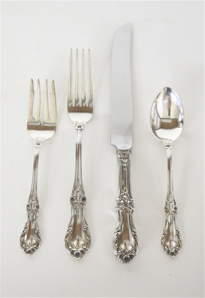 Appraisal: INTERNATIONAL WILD ROSE STERLING SILVER FLATWARE SET plus storage case