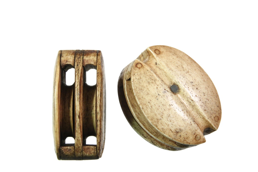 Appraisal: PAIR OF WHALEBONE SHIP PULLEYS - Sailor made two-sheaved whalebone