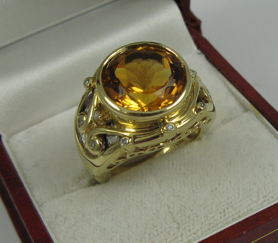 Appraisal: CITRINE DIAMOND AND K GOLD RING with appraisal Centered is