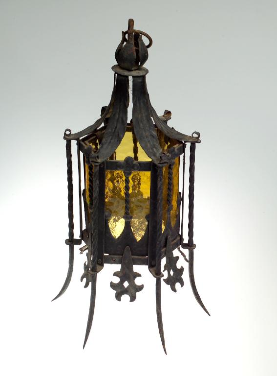 Appraisal: WROUGHT-IRON HALL LANTERN of hexagonal form with amber glass panels