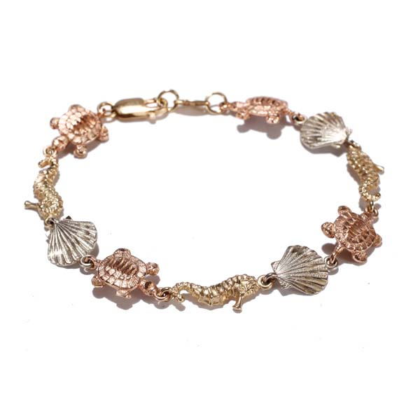 Appraisal: Tri tone K gold sea life charm bracelet with seahorses