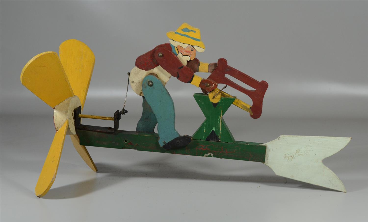 Appraisal: American folk art whirligig with woodcutter wide high distressed paint