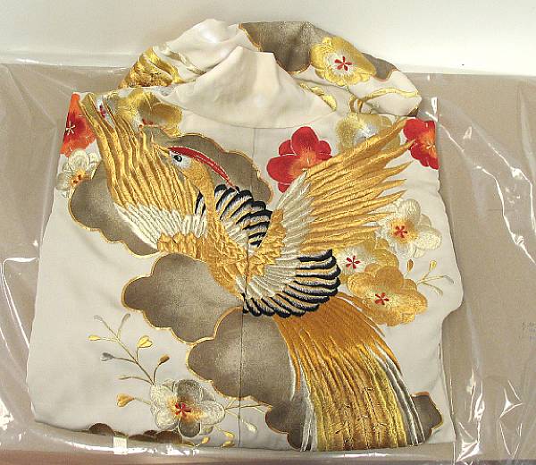 Appraisal: A Japanese embroidered silk uchikake outer kimono The ivory ground