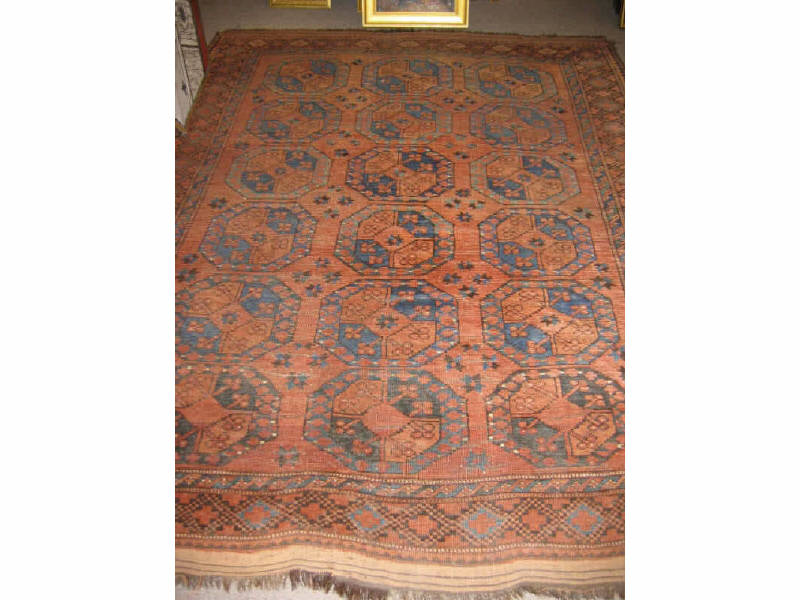 Appraisal: AFGAN ERSARI TRIBAL ROOM RUG The salmon to tan field