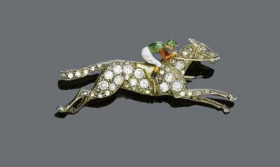 Appraisal: DIAMOND AND ENAMEL BROOCH ca Silver and yellow gold Decorative