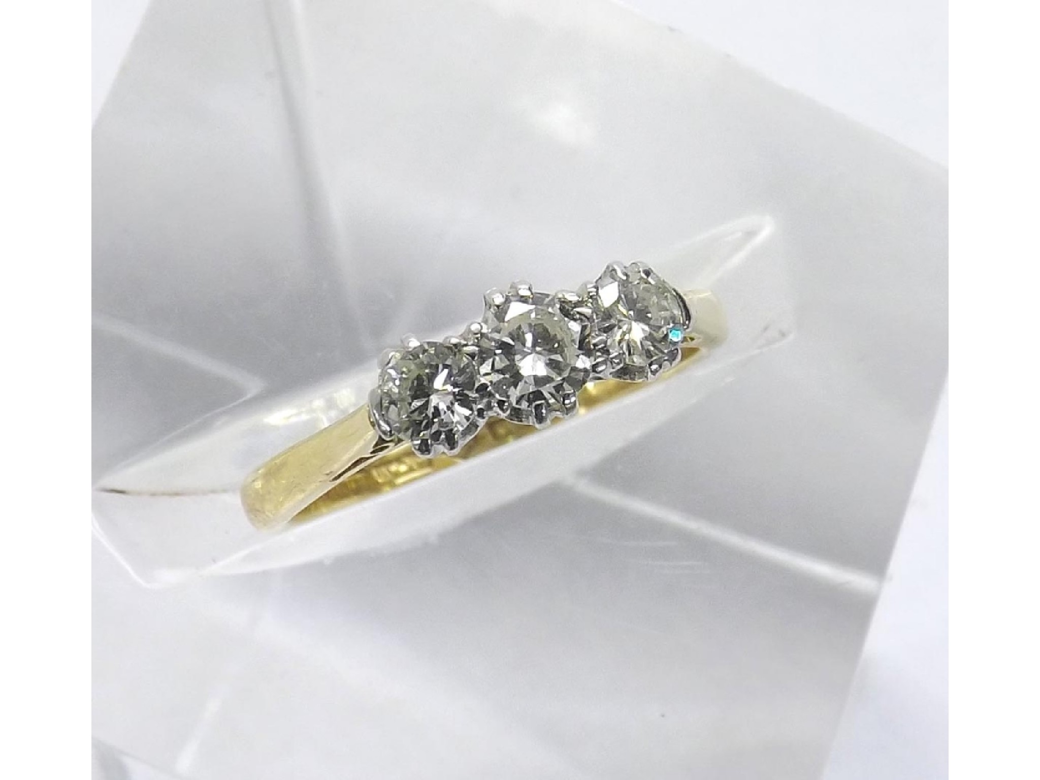 Appraisal: - -a ct and platinum three stone brilliant-cut diamond ring