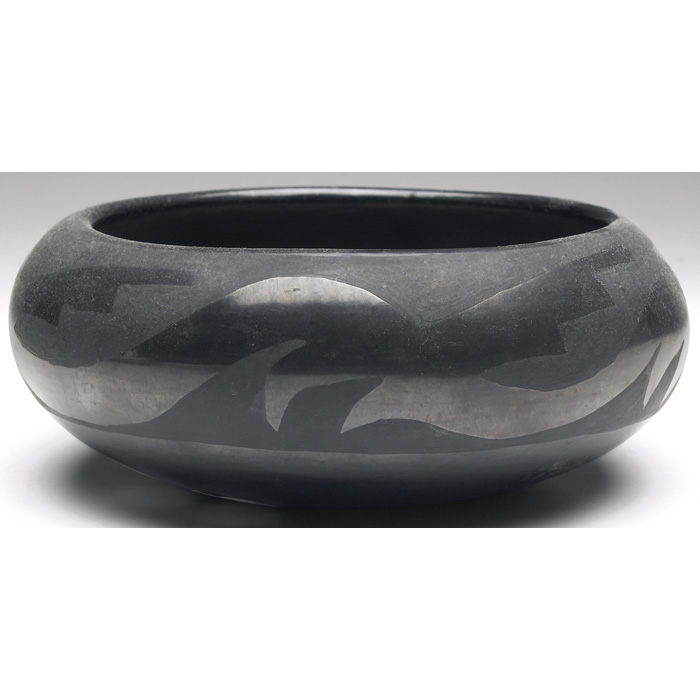 Appraisal: San Ildefonso bowl polished black with a painted avanyu design