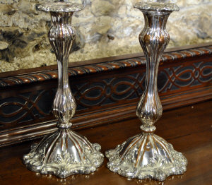 Appraisal: A pair of Victorian plated on copper baluster candlesticks with