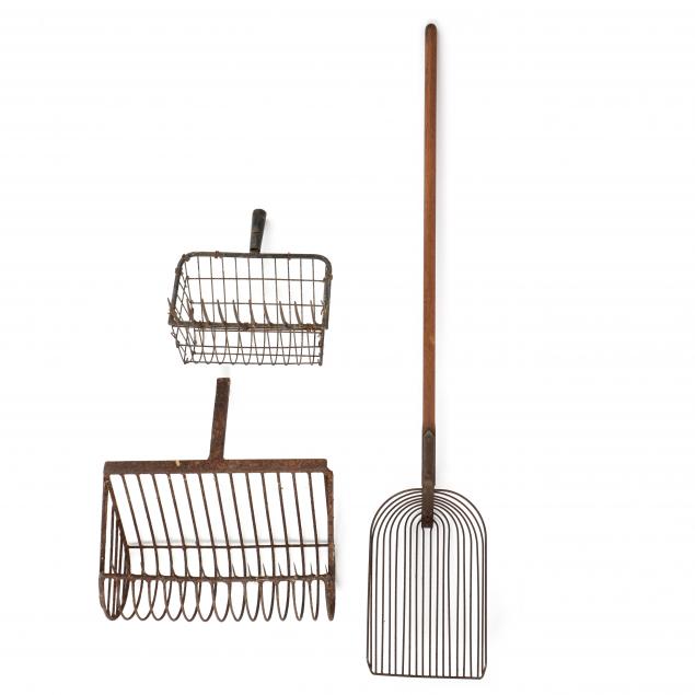 Appraisal: THREE EARLY CLAM RAKES Early twentieth century iron rakes one