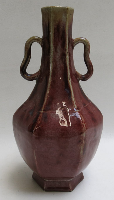 Appraisal: CHINESE RED GLAZE PORCELAIN VASE a -handle octagonal shaped vase