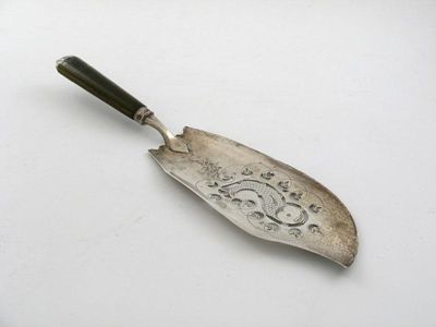 Appraisal: A George III fish slice with a mounted green stained