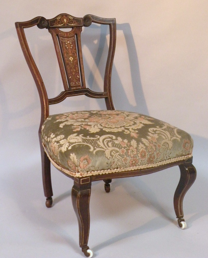 Appraisal: An Edwardian mahogany and boxwood strung salon chair with a