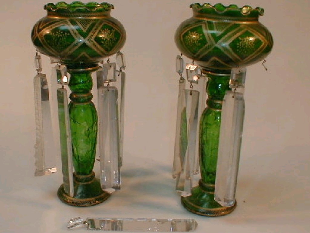 Appraisal: A pair of green glass table lustres enriched with gilt