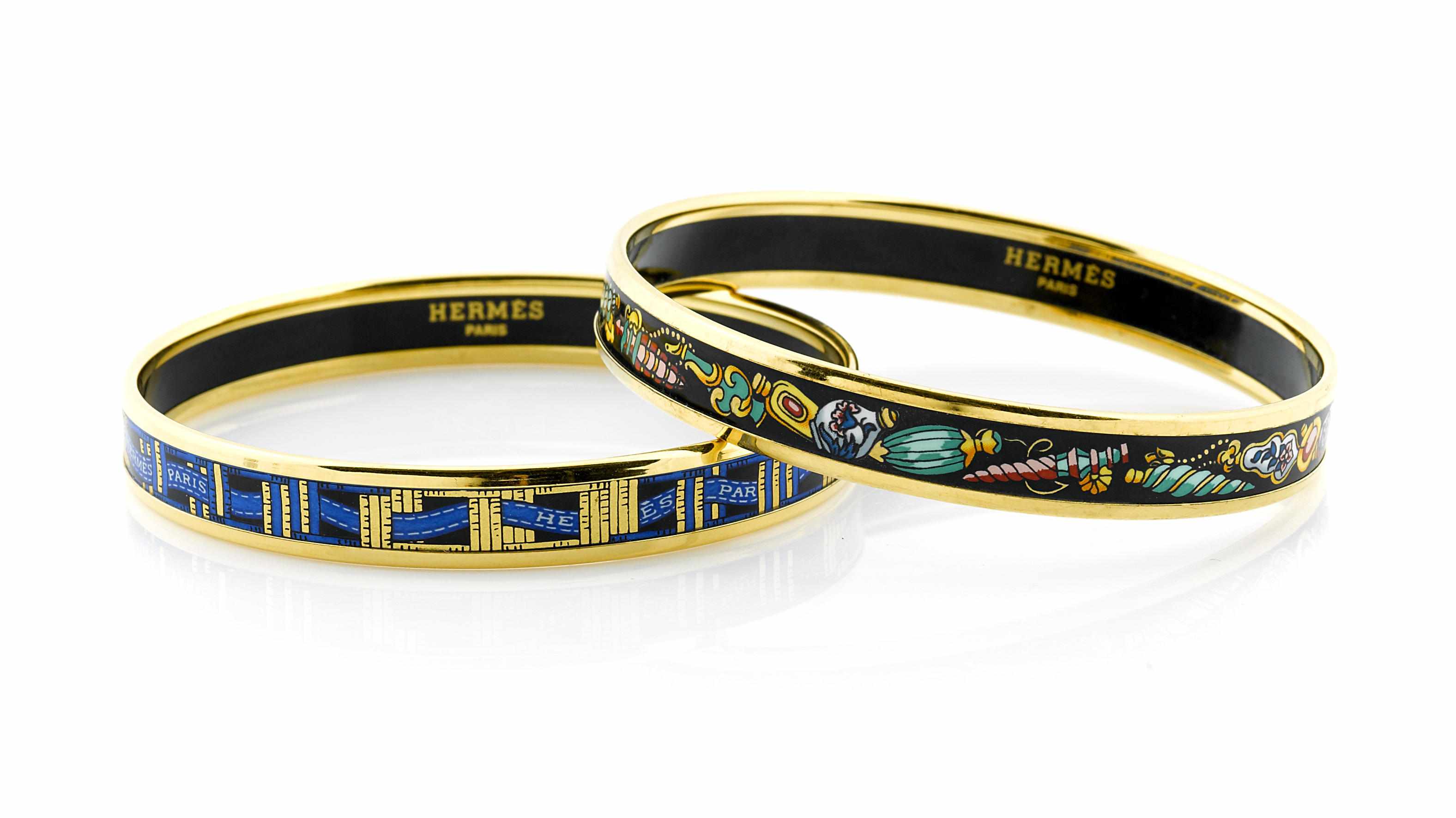 Appraisal: A pair of enamel printed bangle bracelets Herms Paris gold