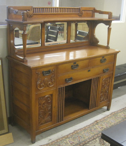 Appraisal: LATE VICTORIAN OAK SIDEBOARD American c having a -mirror and