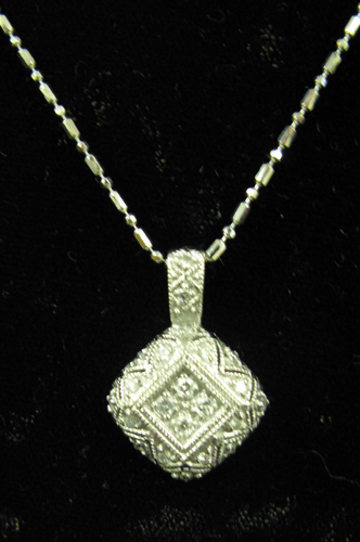 Appraisal: DIAMOND AND FOURTEEN KARAT WHITE GOLD PENDANT NECKLACE The square