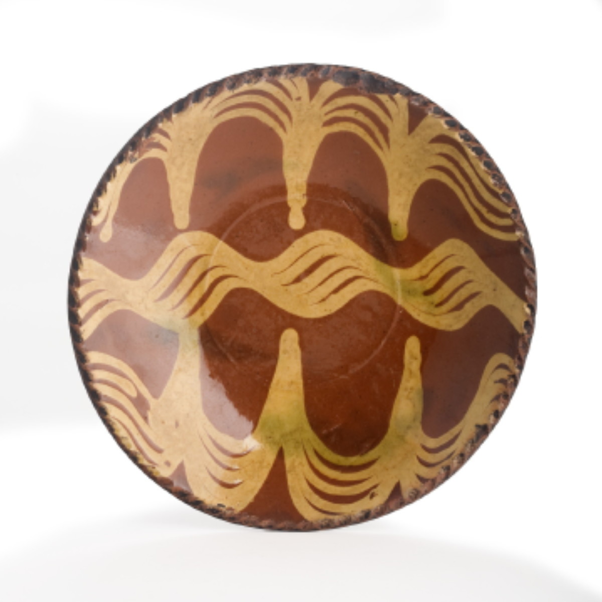 Appraisal: NEW ENGLAND SLIP-DECORATED REDWARE DISH NINETEENTH CENTURY Decorated with a