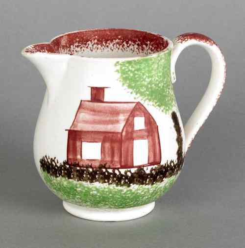 Appraisal: Red spatter creamer with schoolhouse th c h Provenance Bea