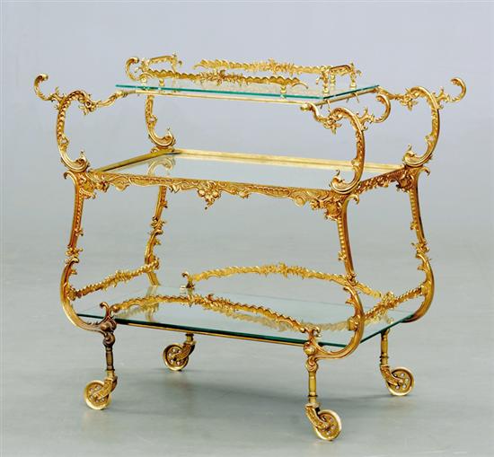 Appraisal: Gilt-metal and glass trolley th century foliate and C-scroll frame