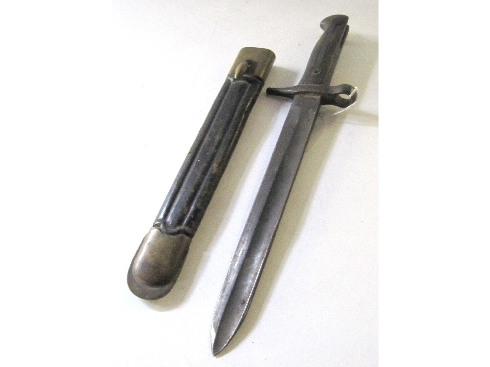 Appraisal: A bayonet in scabbard the blade stamped Brescla