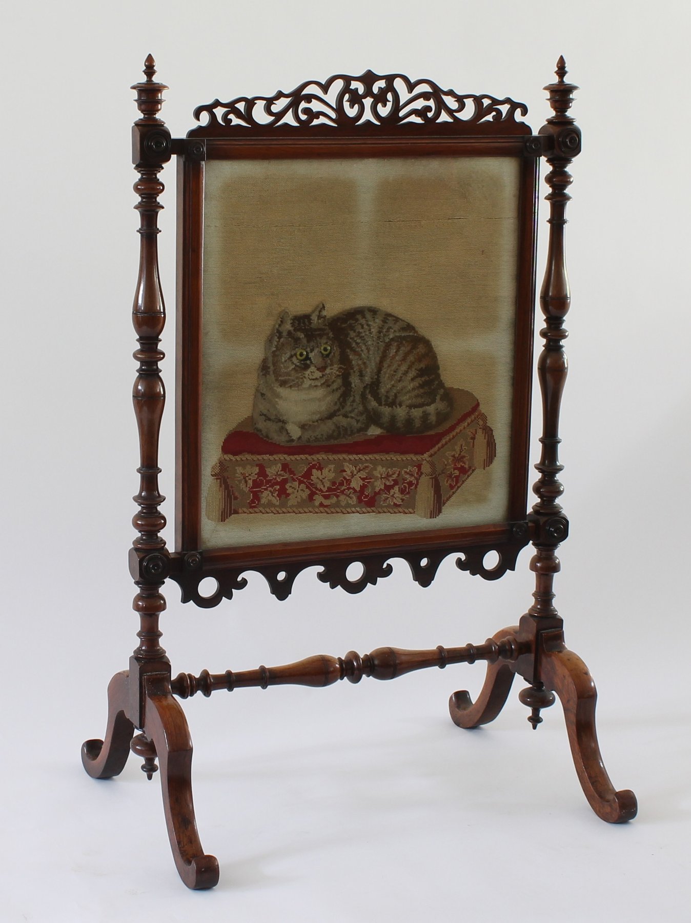 Appraisal: A Victorian fire screen the tapestry panel depicting a recumbant