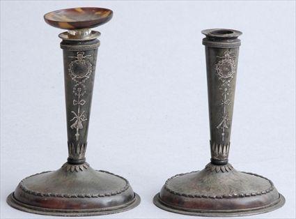 Appraisal: PAIR OF ENGLISH SILVER-INLAID TORTOISESHELL CANDLESTICKS In the Adams style