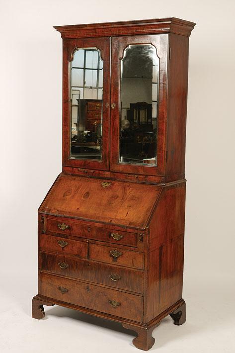 Appraisal: A GEORGE I WALNUT BUREAU BOOKCASE the upper section with