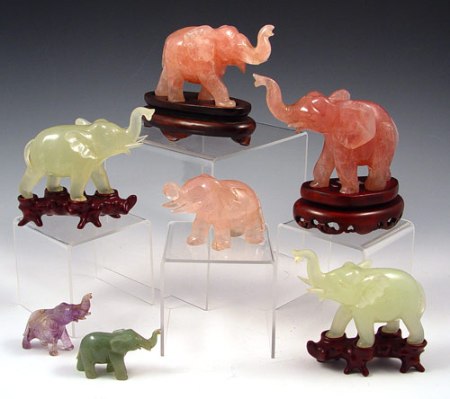 Appraisal: GROUP OF CARVED STONE ELEPHANTS rose quartz amethyst and serpentine