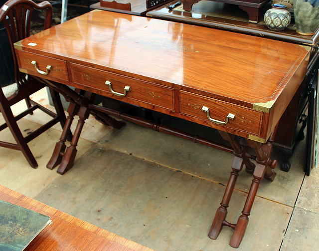 Appraisal: A MODERN TEAK BRASS INLAID CAMPAIGN WRITING DESK with decorative