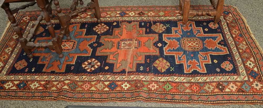 Appraisal: Caucasian Oriental Throw Rug worn through line in middle '