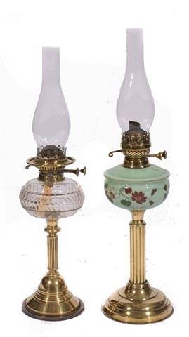 Appraisal: A Victorian brass oil lamp with reeded column and green