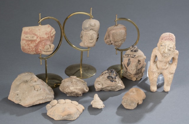 Appraisal: Assortment of Pre-Columbian Carved Stone Faces pieces Mostly human faces