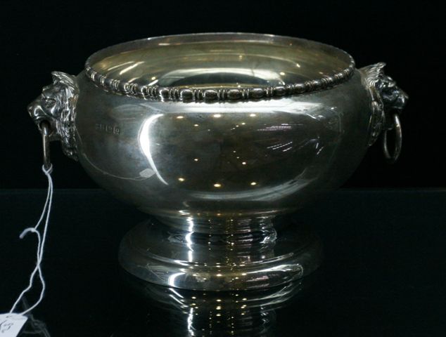 Appraisal: A sterling silver ice bucket Birmingham with lion head handles