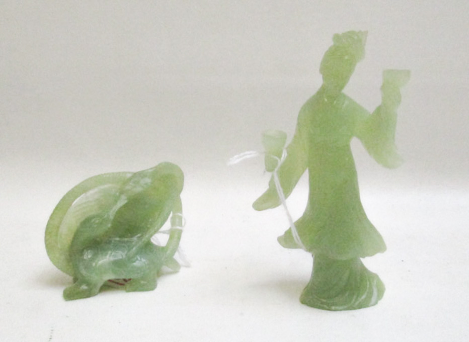 Appraisal: TWO CHINESE CARVED JADE FIGURAL SCULPTURES one of standing figure