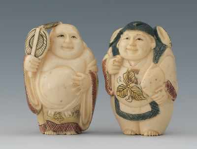 Appraisal: Two Carved Ivory Netsuke Containing a Hotei figure highlighted in