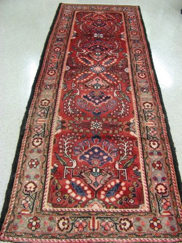 Appraisal: PERSIAN HAMADAN HALL RUG overall floral design on red ground