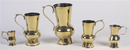 Appraisal: A graduated set of five th century brass measures pint