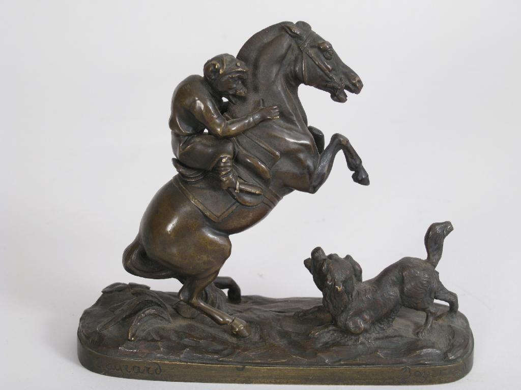 Appraisal: A bronze Figure Group of dog barking at rearing horse