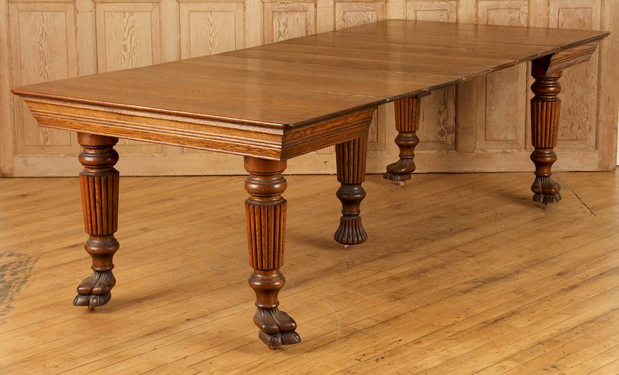 Appraisal: CARVED OAK DINING TABLE BALUSTER LEGS CAMEL FEET A carved