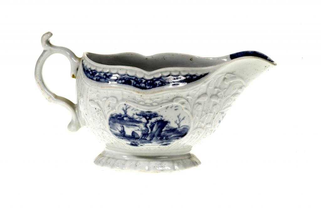 Appraisal: A WORCESTER STRAP FLUTED AND FOLIATE MOULDED SAUCE BOAT the