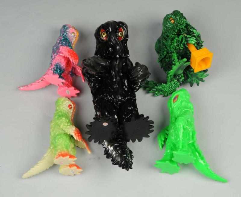 Appraisal: Lot of Hedorah Vinyl Figures Description Includes CCP Kaiju Taro