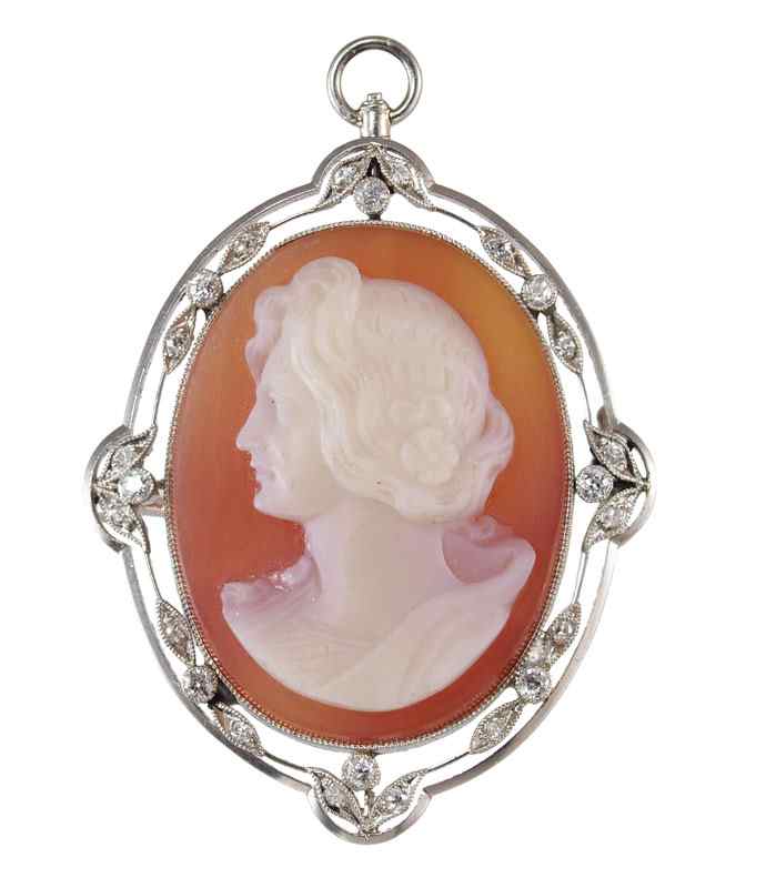 Appraisal: CA s PLATINUM DIAMOND CAMEO BROOCH PENDANT Carved hard stone