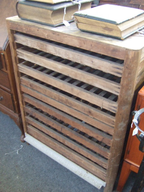 Appraisal: A pine framed fruit drying rack with ten pull-out drawers