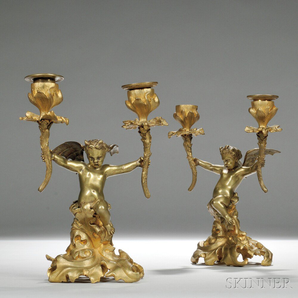 Appraisal: Pair of French th Century Gilt-bronze Figural Two-light Candlesticks each