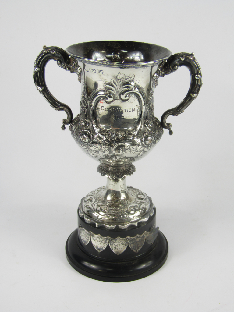 Appraisal: A Victorian silver twin handled sports trophy with embossed floral